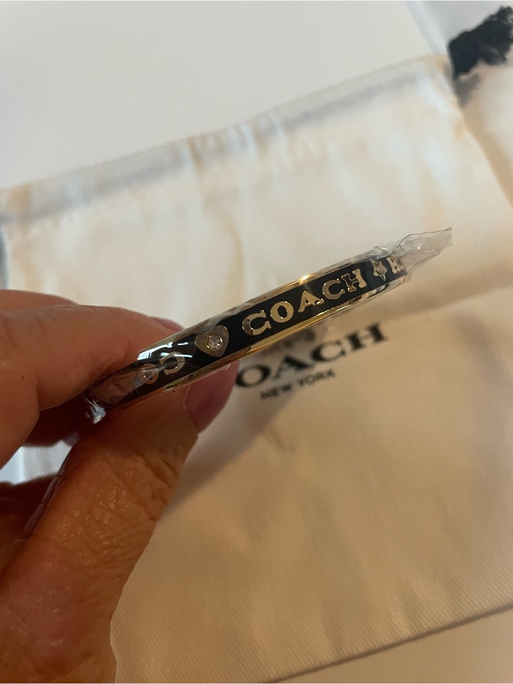 Coach gold -Tone Bangle with Black Enamel Logo